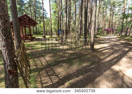Wooden Camping Arbors  With All Conviniences In A Pine Forest