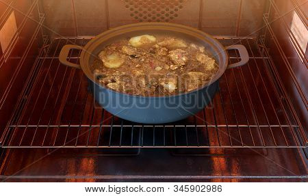 A Close View Of A Pot Of Fish Curry Inside A Hot Household Oven - 3d Render
