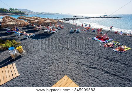 Canary Island Tenerife, Spain - 27 Dec, 2019: Tourists Are Relaxing And Playing On A Beach Called Pl