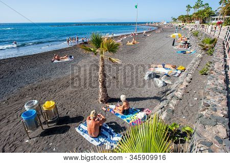 Canary Island Tenerife, Spain - 27 Dec, 2019: Tourists Are Relaxing And Playing On A Beach Called Pl