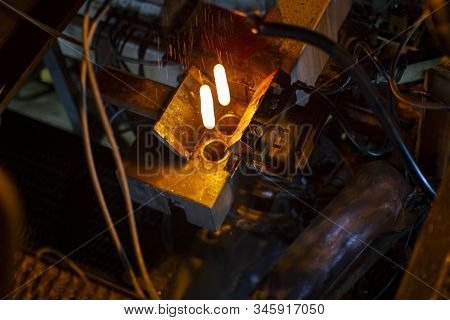 Glassworks. Glass Industry. Burning Blanks Of Glass Bottles In An Industrial Stove