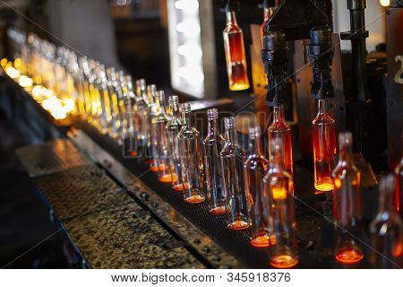 Glassworks. Glass Industry. The Process Of Making Glass Bottles.
