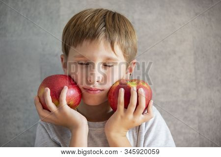 Child With Fruit. Boy With Two Red Apples