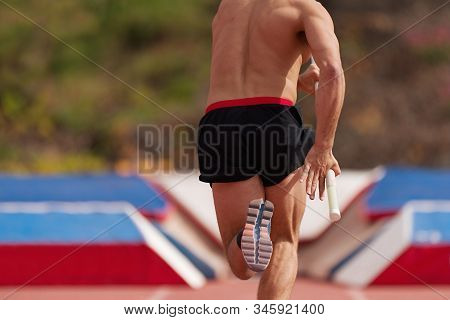 Man Athlete Performs The High Jump Pole Vault