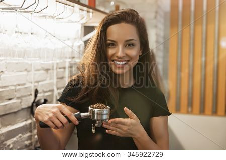 Smiling Barista Woman Standing With Coffee Holder Full Of Ground Coffee In Her Hands , Barist Work R