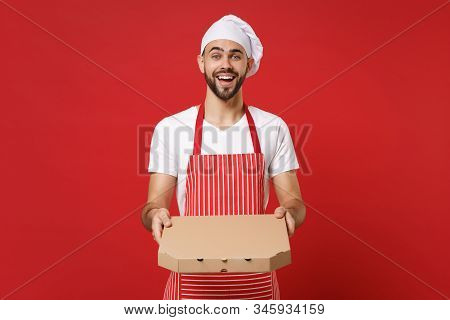 Joyful Young Bearded Male Chef Cook Or Baker Man In Striped Apron Toque Chefs Hat Posing Isolated On