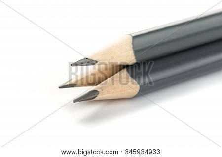 Three  Gray Triangular Pencil Isolated
On White Background