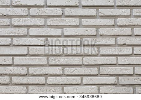 White Brick Wall With Rough Shabby Grain Brick. Decorative Wall Decoration With Stone, Backdrop Text