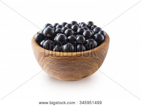 Black Berries On White. Blackcurrants In A Wooden Bowl Isolated On White Background. Blackcurrant Is