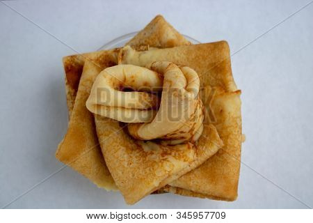 Stack Of Traditional Russian Pancakes Blini On White Background With Copy Space. Homemade Russian Th