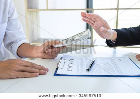 Businessman Refusing Receive Bribe Money In The Envelope Of Their Partner To Give Success The Deal C