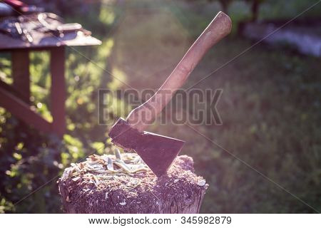 Tapor In A Wooden Bar On A Rustic Background. Chopping Wood