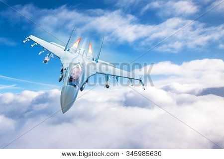 Fighter With Acceleration And Fire From Engines Flying Above The Clouds