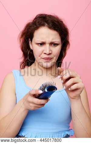 Portrait Of A Woman Removes Hair On A Comb Dissatisfaction Lifestyle Unaltered