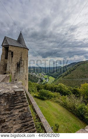Countryside Landscape With Hills Covered With Lush Green Trees, Town Of Bourscheid, Country Road And