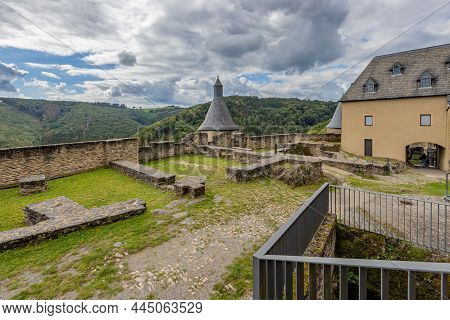 Esplanade With Small Walls In The Medieval Castle Of Bourscheid, Roof Of Towers And A Spectacular La