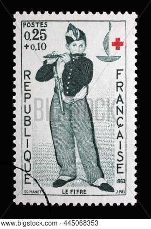 ZAGREB, CROATIA - JULY 03, 2014: Stamp printed in the France shows The Fifer (Young Flautist) - by Edouard Manet, Series Red Cross, circa 1963