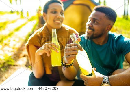 African People On Camping Trip Welcoming A New Day In Summer Park