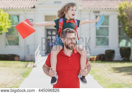 Outdoor School. School Boy Going To School With Father. Dad And Son Having Fun Near School Yard. Con