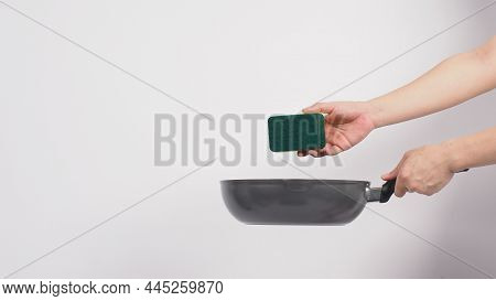 Hand Cleaning The Non Stick Pan With Handy Dish Washing Sponge