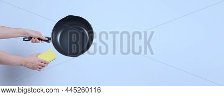 Hand Cleaning The Non Stick Pan With Handy Dish Washing Sponge