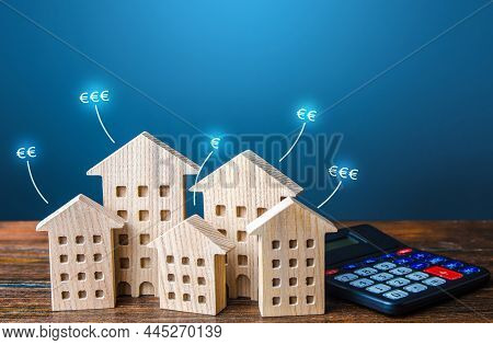 Residential Buildings With Euro Price Tags And Calculator. Property Valuation. Investment Business P