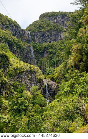 Spectacular Double Waterfall Falling Through Jungle Forest.