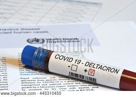 Blood Tube For Test Detection Of Virus Covid-19 Deltacron Variant With Positive Result On Papers Doc