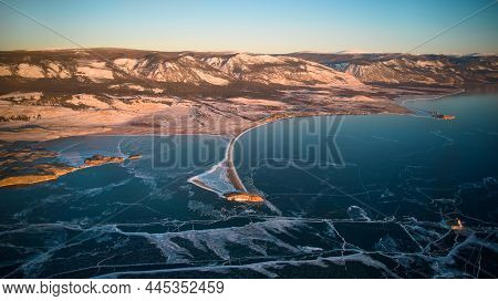 View Of The Frozen Lake Baikal In January At Dawn. Kurma Bay, Cape Uyuga From The Air. Transparent I