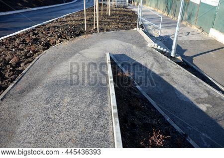 Wheelchair Ramp And Stairs On The Other Side. Height Differences Are Tastefully And Functionally Sol