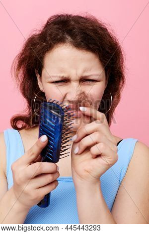 Portrait Of A Woman Removes Hair On A Comb Dissatisfaction Lifestyle Unaltered