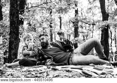 Healthy Snack. Bite Juicy Apple. Family Picnic. Hipster Bearded Dad With Son Spend Time In Forest. B
