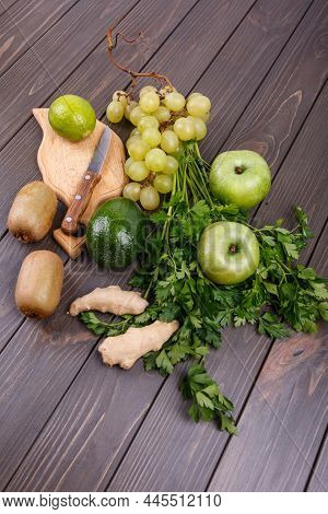 Healthy Green Vegetables And Fruits For Smoothie Lie On The Tabl