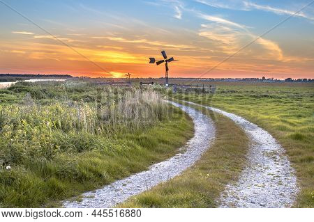 Old American Windmill At Sunset In Dutch Rural Landscape Near Jisp, Noord Holland, Netherlands