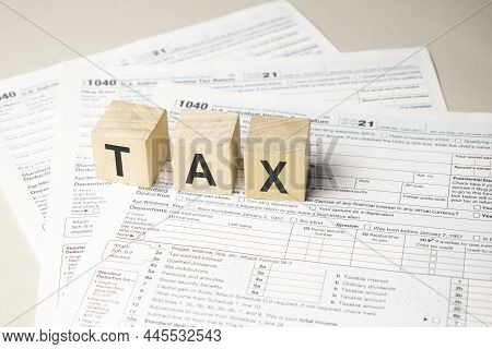 Word Tax Written On Wooden Cubes. Tax Concept