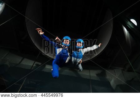 A Man And A Woman Enjoy Flying Together In A Wind Tunnel. Free Fall Simulator