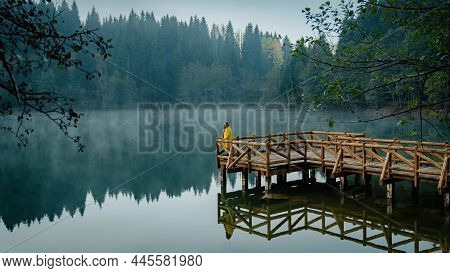 Artvin, Turkey - October 2021: Man On A Wooden Pier In Savsat Karagol Black Lake In Black Sea Region