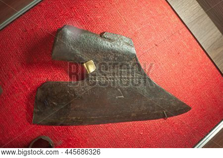 Old Rusted Metal Axe On Grey Weathered Wooden Background With Empty Copy Space