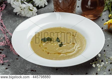 Delicious Cream Soup With Bread On The Table