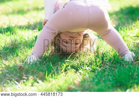 Lifestyle Portrait Baby Girl Child In Happines At The Outside In The Meadow Upside Down.