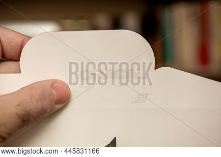 Paris, France - Nov 29, 2021: Pov Male Hand Holding Part Of Oracal With Its Logotype Insignia And Te