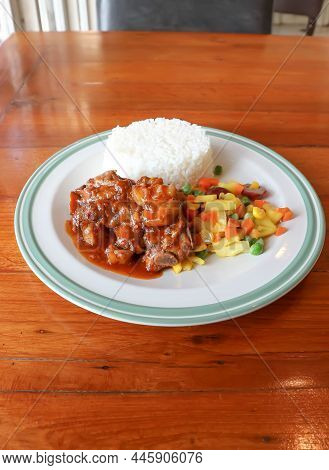 Stewed Pork ,pork With Rice And Sauce Or Rice Topped With Stew Pork And Vegetable