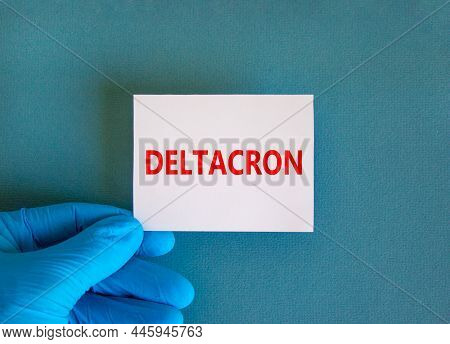 Covid-19 Corona Deltacron Variant Symbol. Hand In Blue Glove With White Card. The Concept Word Delta