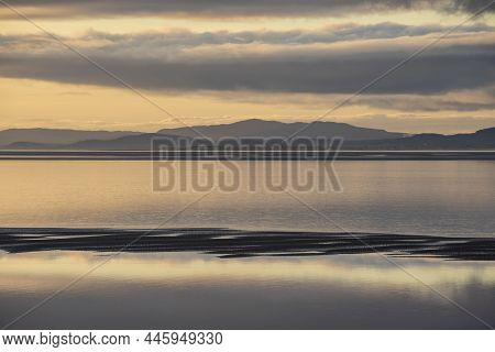 Epic Sunset Landscape Image Of Solway Firth Viewed From Silloth During Stunning Autumn Sunset With D