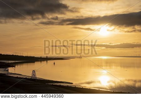 Epic Sunset Landscape Image Of Solway Firth Viewed From Silloth During Stunning Autumn Sunset With D
