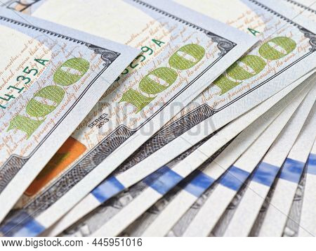 American Banknotes Of One Hundred Dollars. Fragment Of Bills Close-up. New Sample Money. Focus On Th
