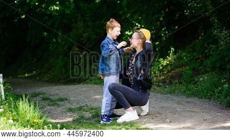 A Series Of Photos With A Child With Autism. Down Syndrome. Boy With Cerebral Palsy. Walks In Nature