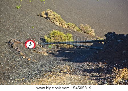 Turnpike And Stop Sign For Walkers In Timanfaya National Park