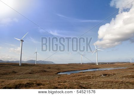 Sunshine And Bogland With Wind Turbines