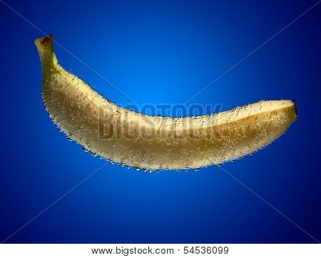 Banana Into Water On Blue